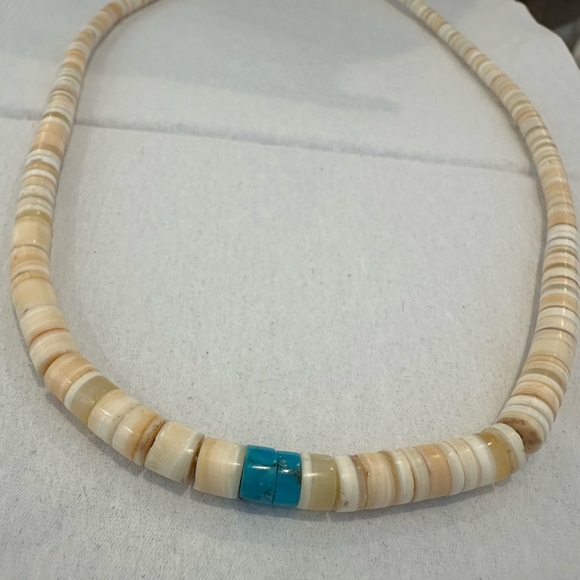 This is a vintage Santo Domingo heishi necklace in shell and turquoise